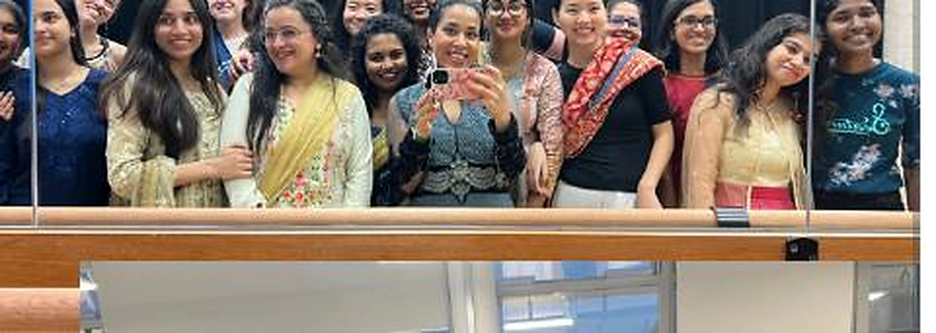 BollyFusion participants celebrating together in colourful South Asian clothing