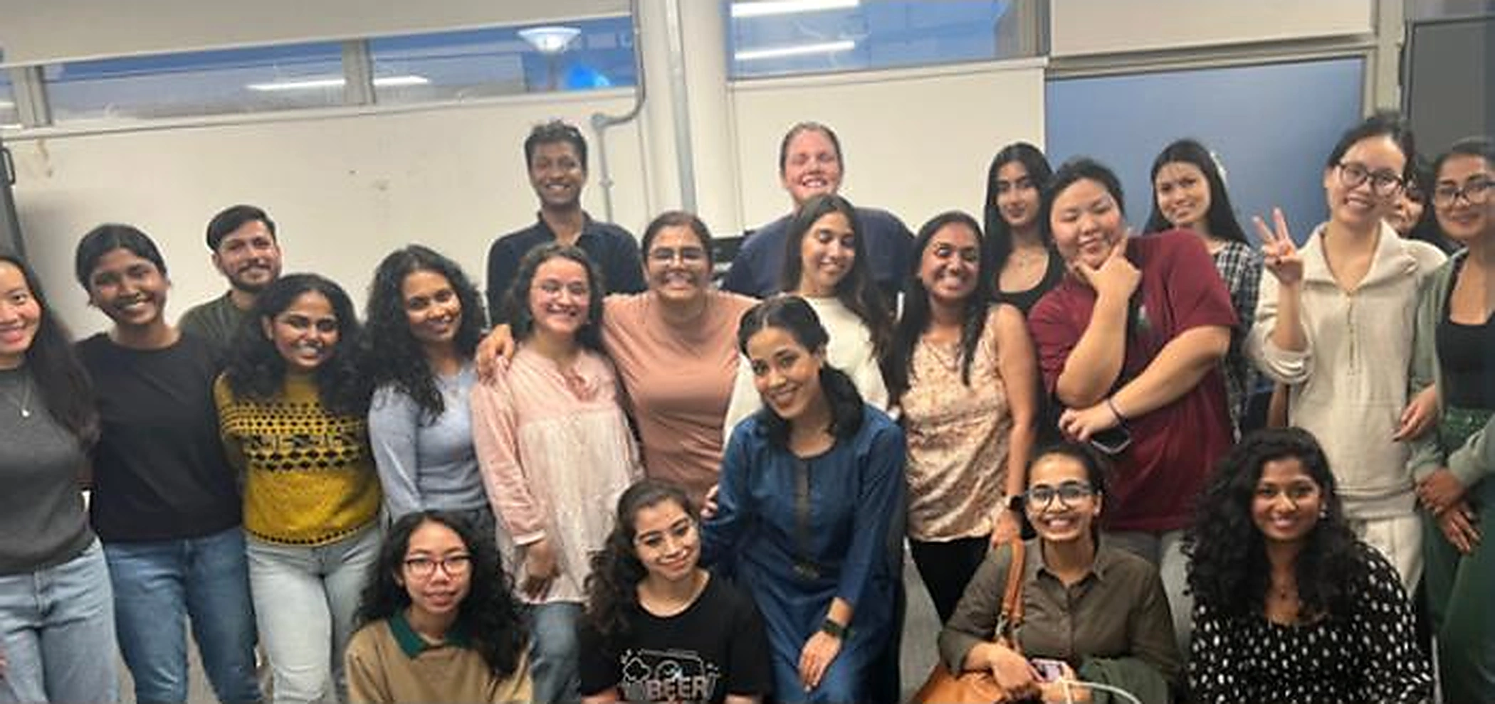 A large group gathered after an inclusive BollyFusion workshop